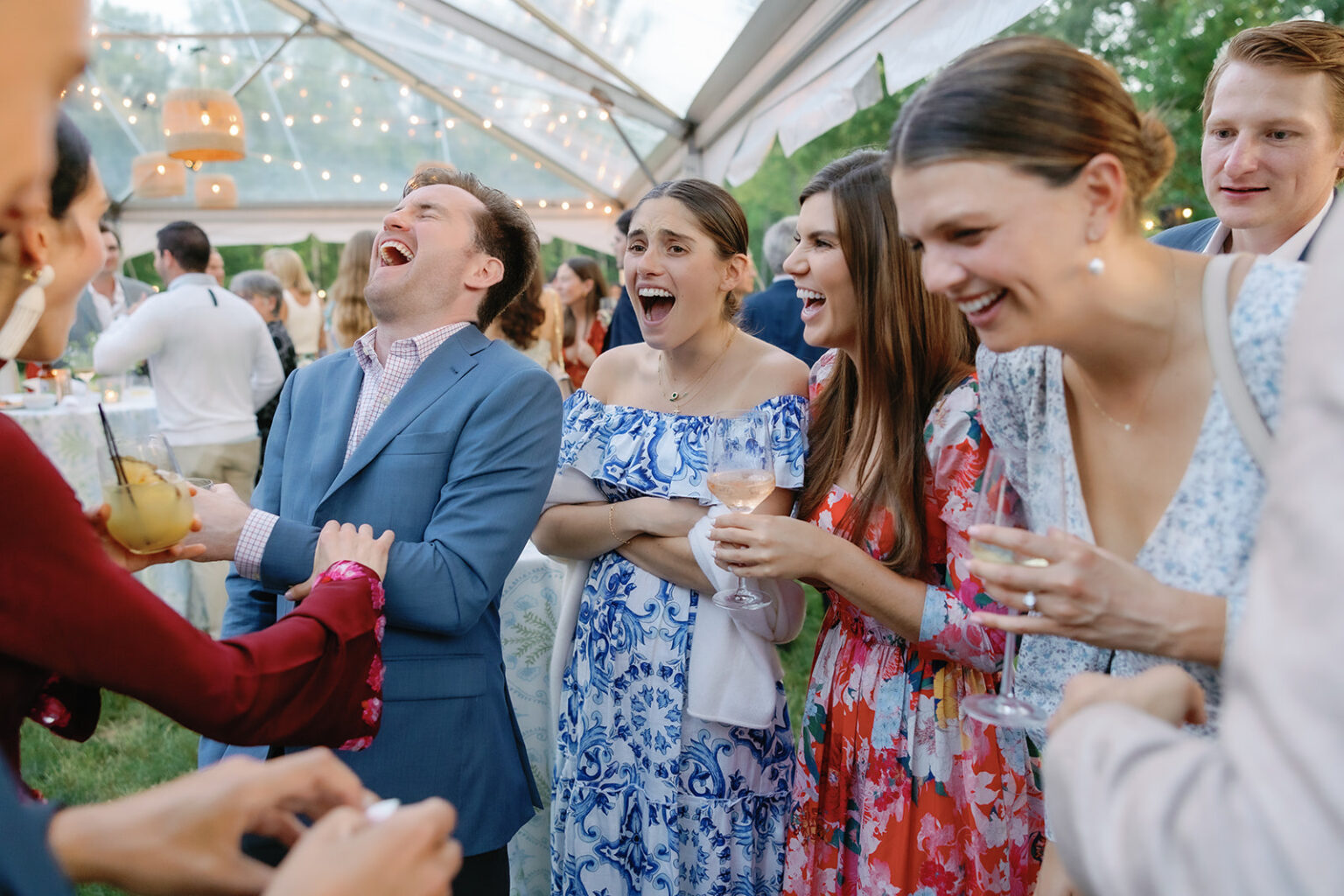 people laughing at a magic trick