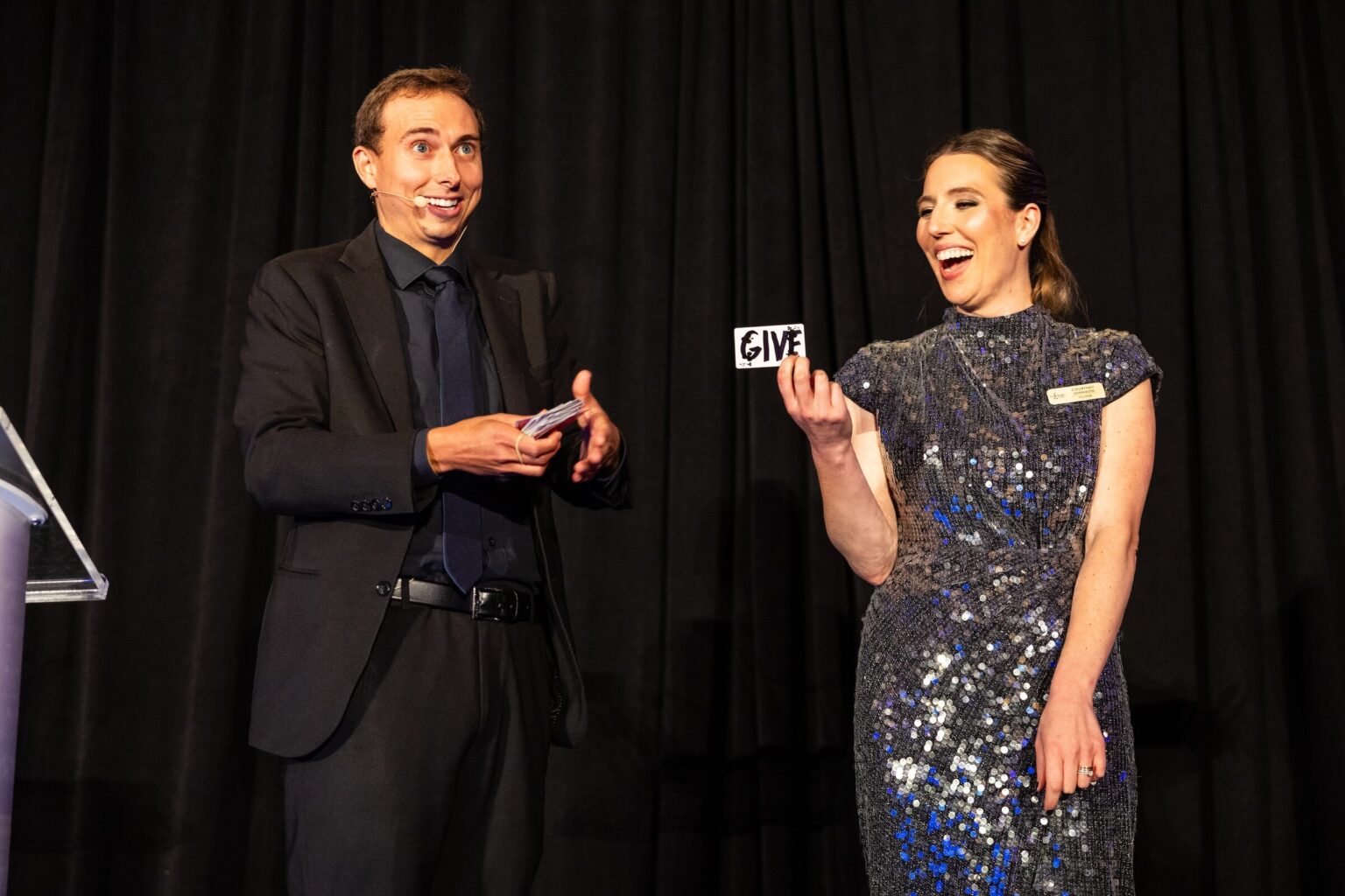 Amory on stage doing a magic trick